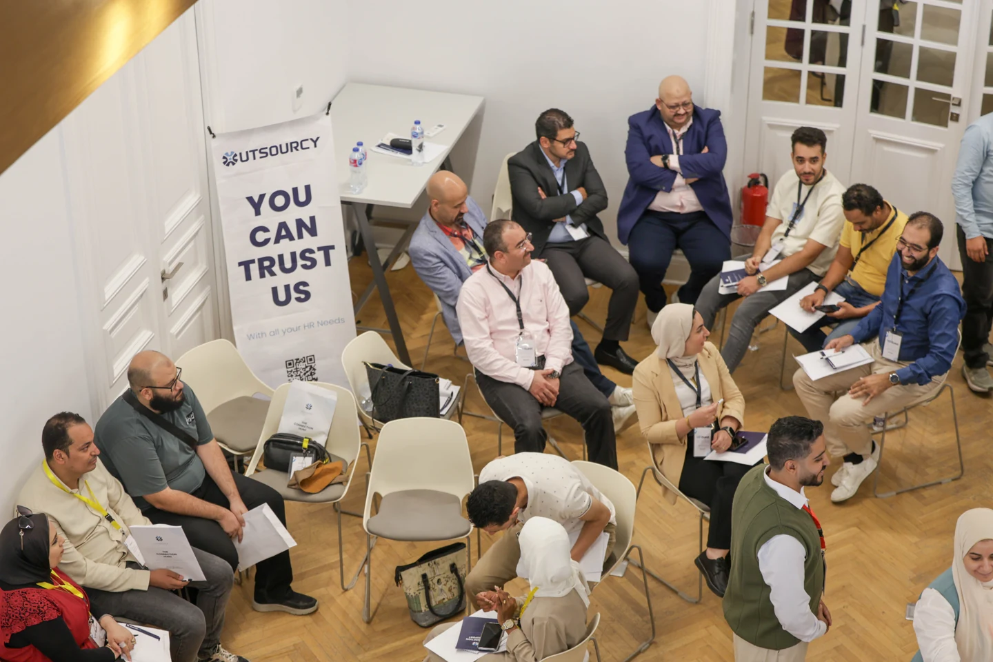 Participants seated around discussion tables